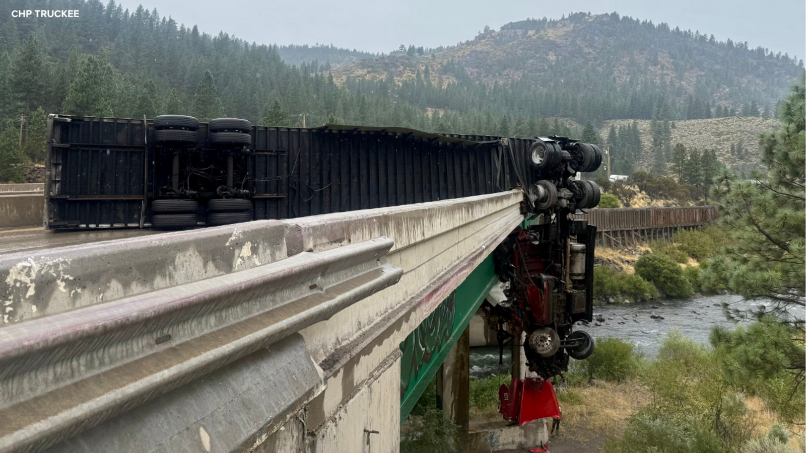 Big rig crash on I-80 near California-Nevada border leaves truck hanging off bridge, CHP says