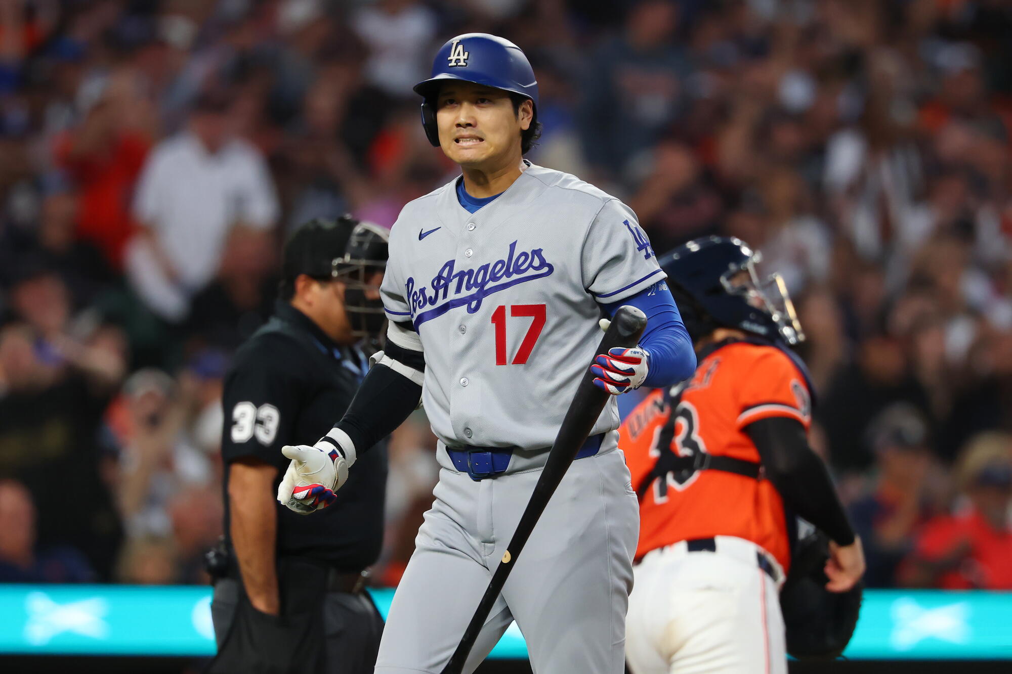 Dodgers star Shohei Ohtani reacts after striking out in the sixth inning against the Tigers on Friday.