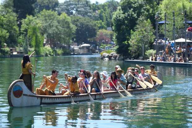 Disneyland guest row up the Rivers of America as they ride the Davy Crockett Explorer Canoes in Anaheim, California, on Friday, July 28, 2017. (Photo by Jeff Gritchen, Orange County Register/SCNG)