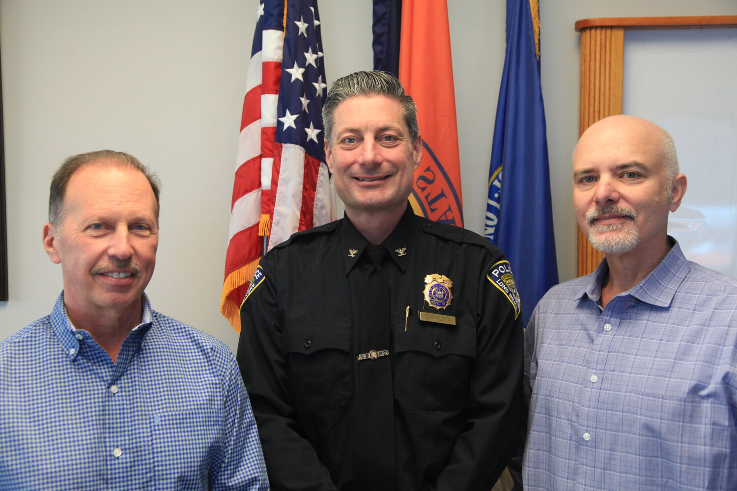 Acting Police Commissioner Richard DePalma, center, in 2024 during his swearing-in ceremony, with Deputy City Manager Phil Ragona, left, and City Manager Dan Creighton.