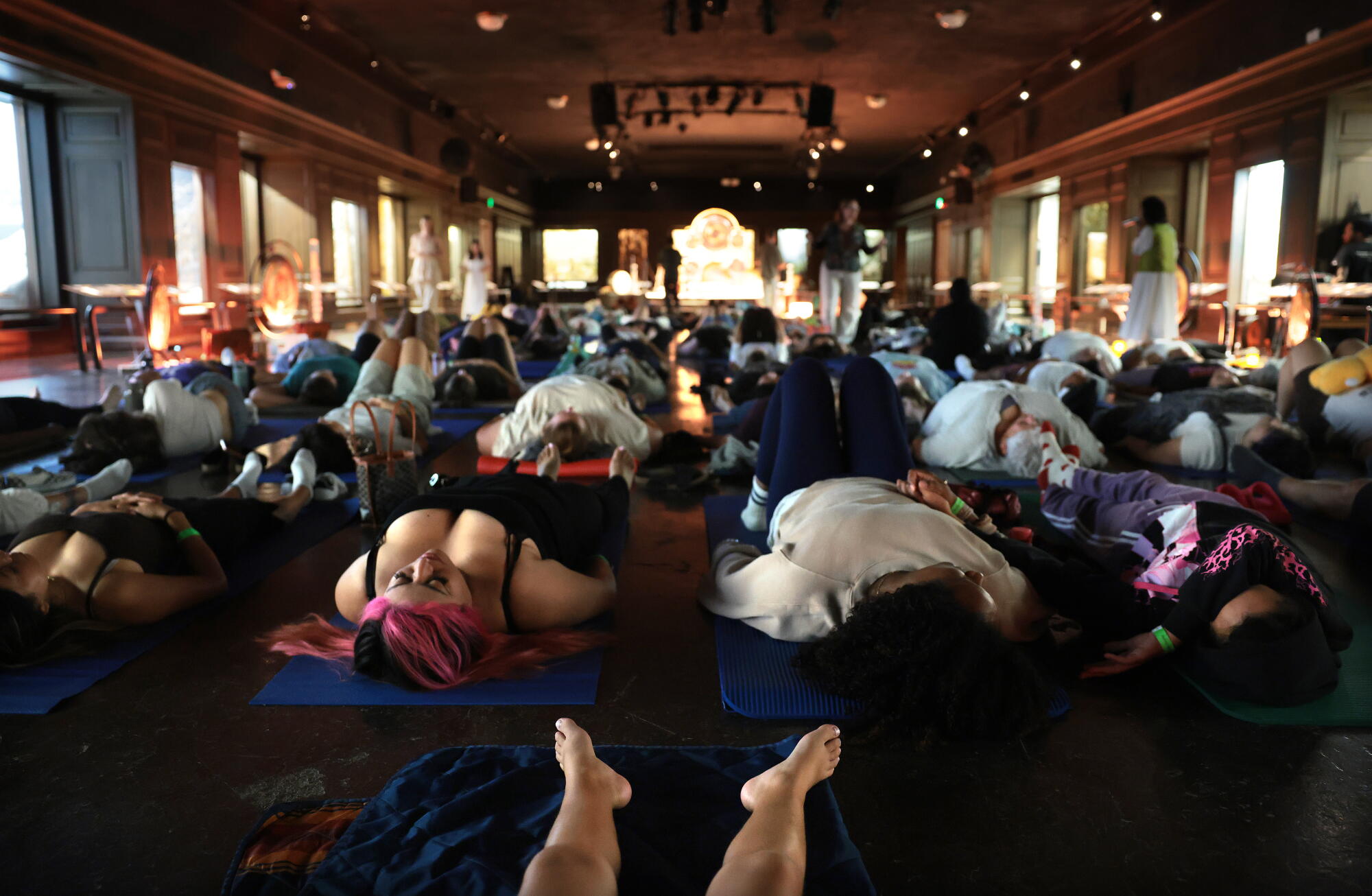 People laying down on the floor during a sound bath. 
