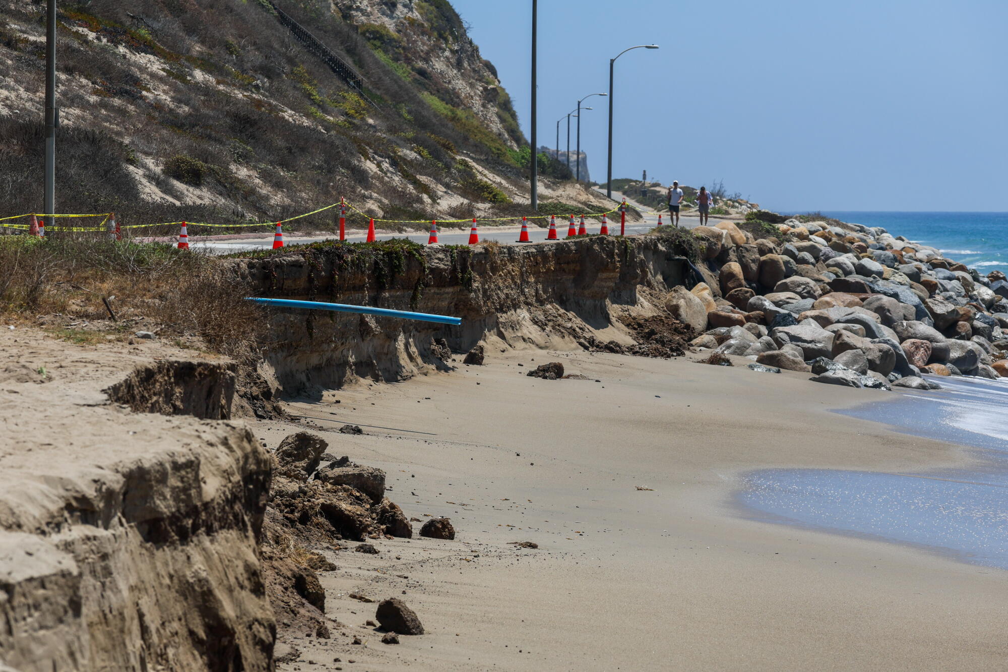 A portion of Westward Beach Road is blocked on Aug. 2 after extreme waves eroded the beach and nearly undermined the road.