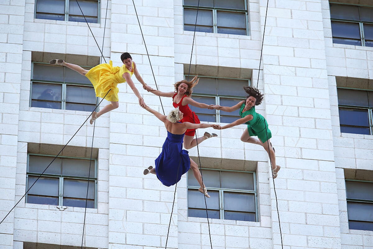 The Bandaloop aerial dancers perform to the side of City Hall in downtown Los Angeles in 2017.