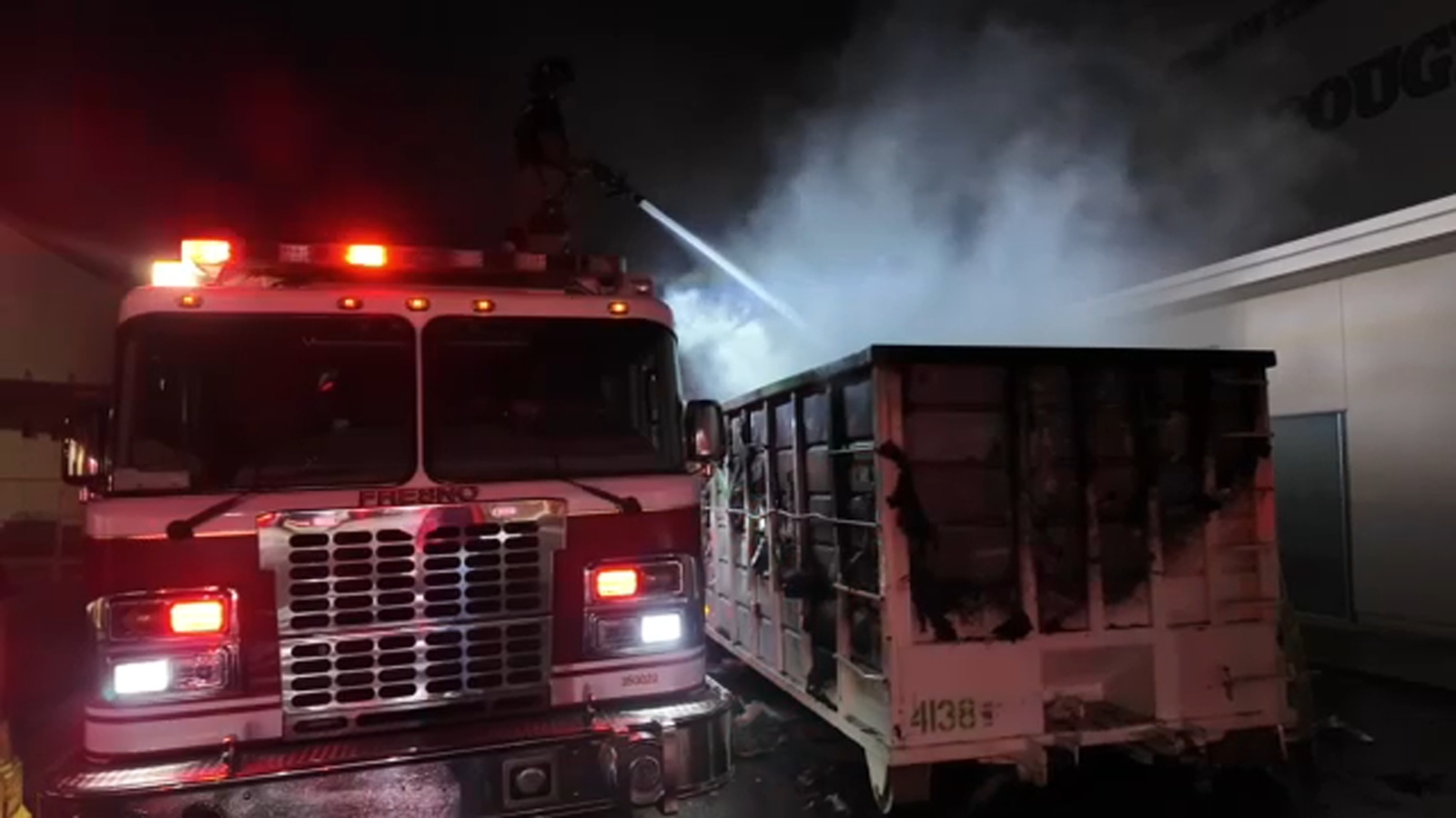 Firefighters protect Roosevelt High School after dumpster fire sparked
