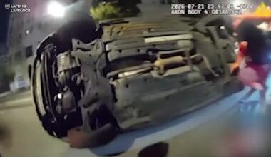 Los Angeles police bodycam video shows dramatic rescue of person pinned under car after crash