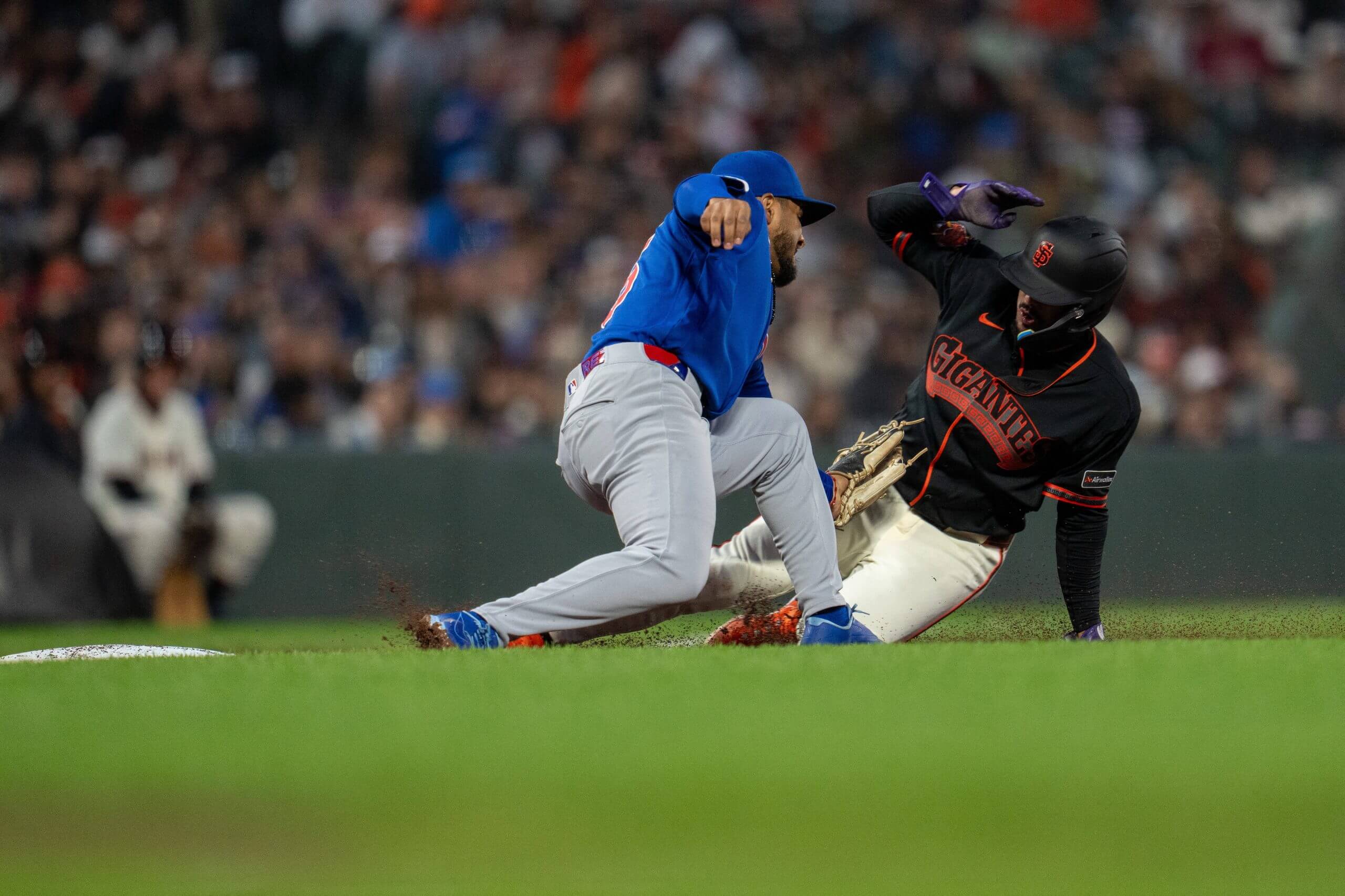 San Francisco Giants shortstop Willy Adames (2) is caught stealing third base by Chicago Cubs third baseman Pedro Ramírez (75) during the fourth inning at Oracle Park.
