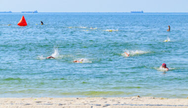 Nearly 150 swimmers made the one-mile ocean swim to honor Long Beach lifeguards who&rsquo;ve died over the years. Participants from 14 to 81 years old completed the challenge.