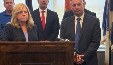 Nassau County D.A. Anne Donnelly, at podium, with Long Beach City Councilman Mike Reinhart, left; FBI Special Agent in Charge Mike Ratta; and acting Police Commissioner Richard DePalma.