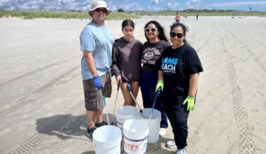 The Siskos, Long Beach locals, turned the cleanup into a family event. Robert, left, Laina, Liahna and Krystal spent the day filling their buckets.