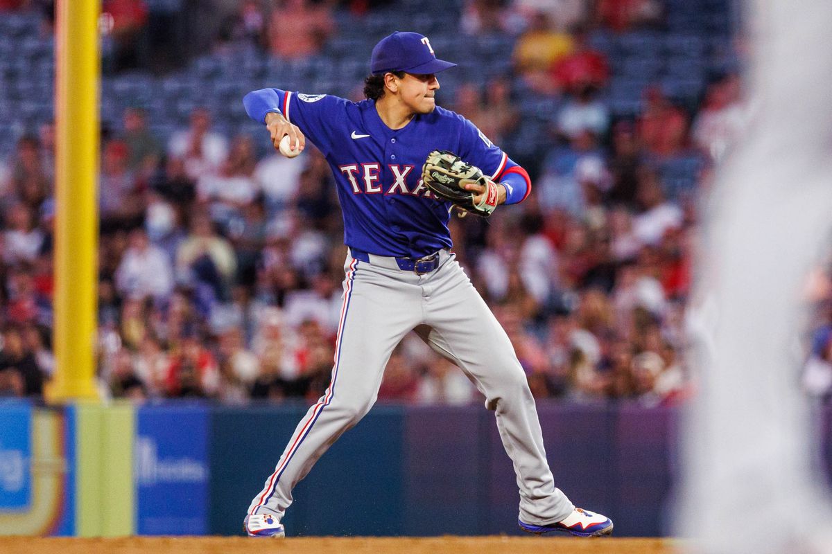 Nicky Lopez #33 of the Texas Rangers throws the ball to first base during an MLB game against the Los Angeles Angels on August 12, 2026 at Angel Stadium in Anaheim, California. Nicky Lopez #33 of the Texas Rangers throws the ball to first base during an MLB game against the Los Angeles Angels on August 12, 2026 at Angel Stadium in Anaheim, California.