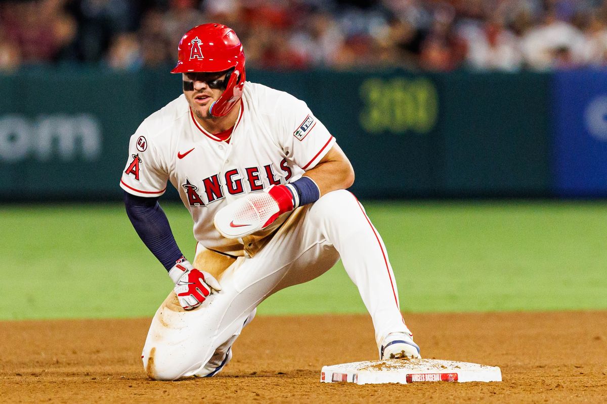 Mike Trout #27 of the Los Angeles Angels after stealing second base during an MLB game against the Texas Rangers on August 12, 2026 at Angel Stadium in Anaheim, California. Mike Trout #27 of the Los Angeles Angels after stealing second base during an MLB game against the Texas Rangers on August 12, 2026 at Angel Stadium in Anaheim, California.