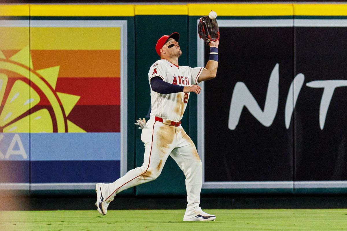Mike Trout #27 of the Los Angeles Angels catches a fly ball during an MLB game against the Texas Rangers on August 12, 2026 at Angel Stadium in Anaheim, California. Mike Trout #27 of the Los Angeles Angels catches a fly ball during an MLB game against the Texas Rangers on August 12, 2026 at Angel Stadium in Anaheim, California.