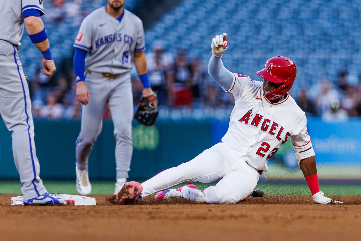 Denzer Guzmán #23 of the Los Angeles Angels slides into second base during an MLB game against the Kansas City Royals on August 14, 2026 at Angel Stadium in Anaheim, California. Denzer Guzmán #23 of the Los Angeles Angels slides into second base during an MLB game against the Kansas City Royals on August 14, 2026 at Angel Stadium in Anaheim, California.