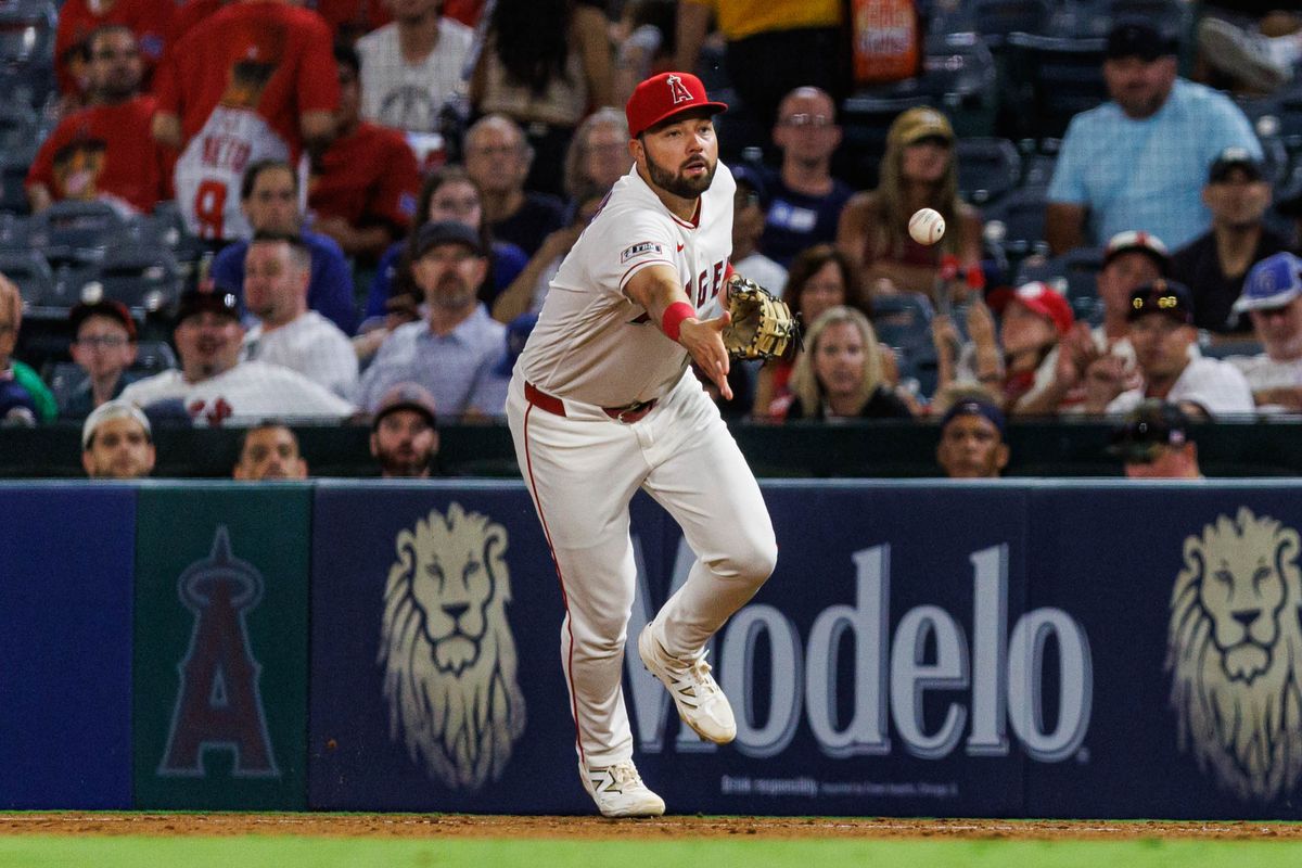 Nolan Schanuel #18 of the Los Angeles Angels tosses the ball during an MLB game against the Kansas City Royals on August 14, 2026 at Angel Stadium in Anaheim, California. Nolan Schanuel #18 of the Los Angeles Angels tosses the ball during an MLB game against the Kansas City Royals on August 14, 2026 at Angel Stadium in Anaheim, California.