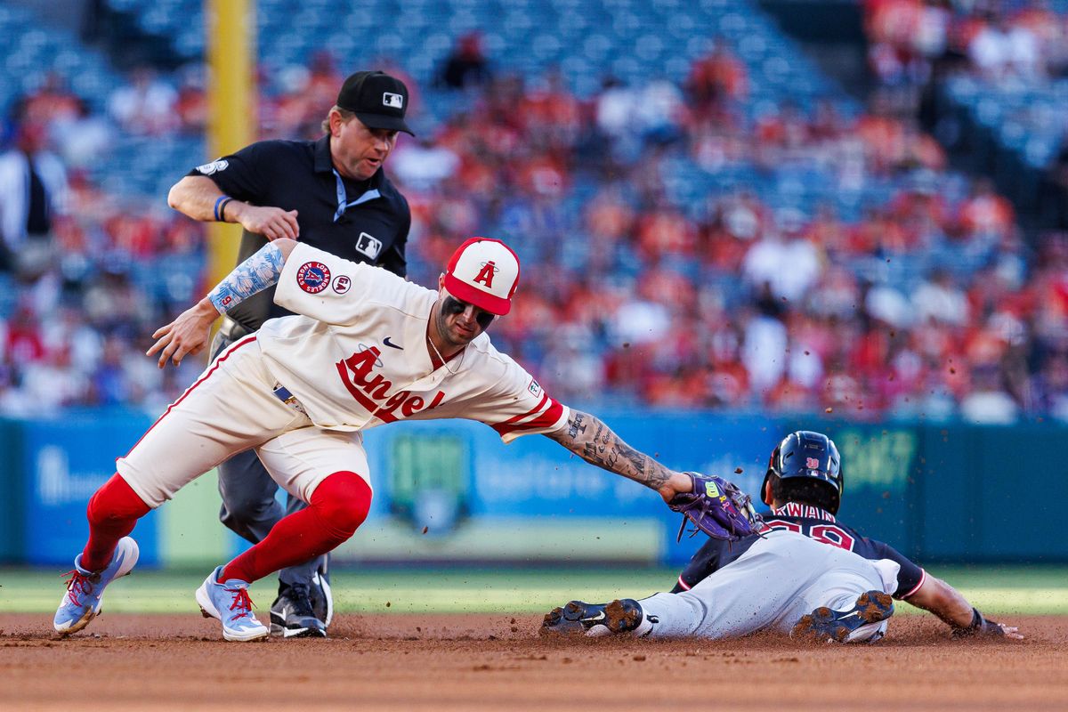 Zach Neto #9 of the Los Angeles Angels tags out Steven Kwan #38 of the Cleveland Guardians during an MLB game against the Cleveland Guardians on August 24, 2026 at Angel Stadium in Anaheim, California. Zach Neto #9 of the Los Angeles Angels tags out Steven Kwan #38 of the Cleveland Guardians during an MLB game against the Cleveland Guardians on August 24, 2026 at Angel Stadium in Anaheim, California.