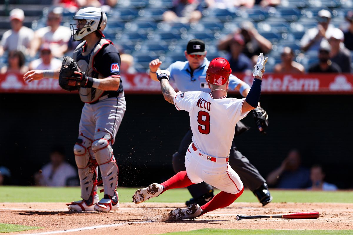Zach Neto #9 of the Los Angeles Angels slides into home plate during the game against the Cleveland Guardians at Angel Stadium of Anaheim on August 26, 2026 in Anaheim, California.
