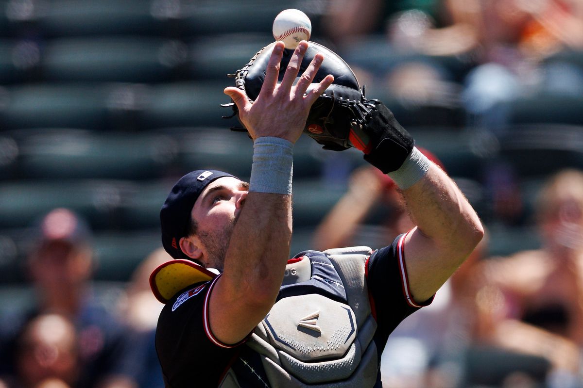 Austin Hedges #27 of the Cleveland Guardians catches a foul ball during the game against the Los Angeles Angels at Angel Stadium of Anaheim on August 26, 2026 in Anaheim, California.