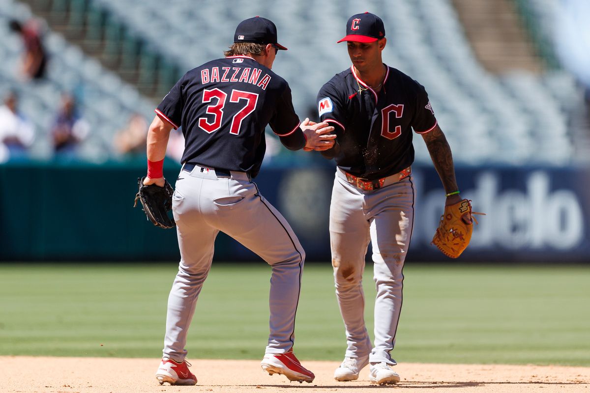 Travis Bazzana #37 of the Cleveland Guardians celebrates with Brayan Rocchio #4 of the Cleveland Guardians during the game against the Los Angeles Angels at Angel Stadium of Anaheim on August 26, 2026 in Anaheim, California. 