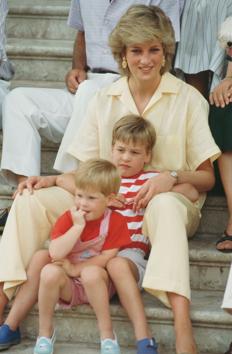 Princess of Wales with her sons William and Harry during a holiday with the Spanish royal family in 1987