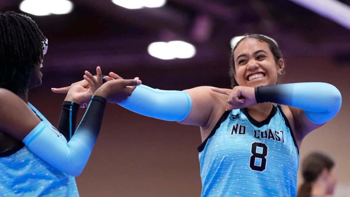 Two girls celebrate with each other