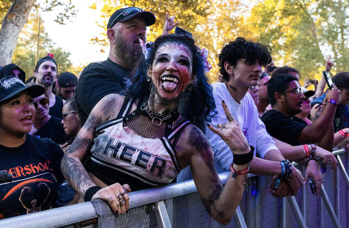 Tanya Freshour of West Sacramento gets ready to cheer, goth style, for Hinder during the Aftershock festival on Sunday, Oct. 5, 2025, in Sacramento’s Discovery Park.