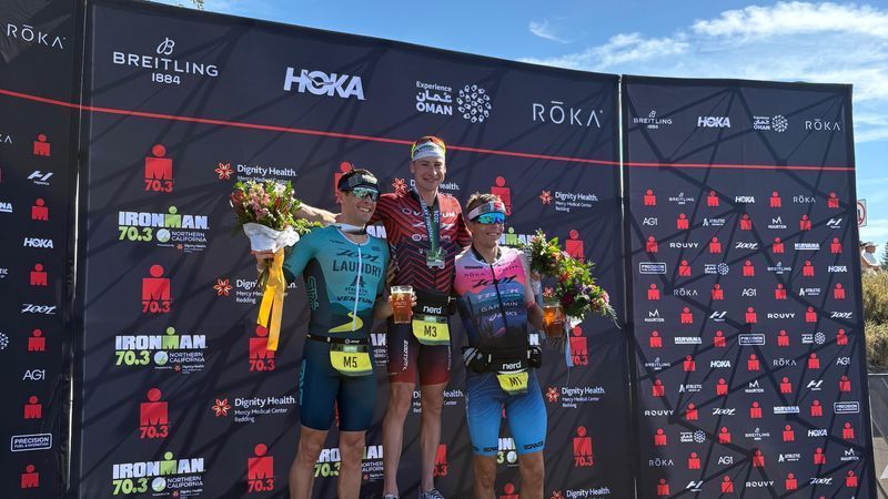 Competitors Jason West, Jackson Laundry and Sam Long atop the IRONMAN 70.3 podium on Aug. 16, in Redding. (KRCR)