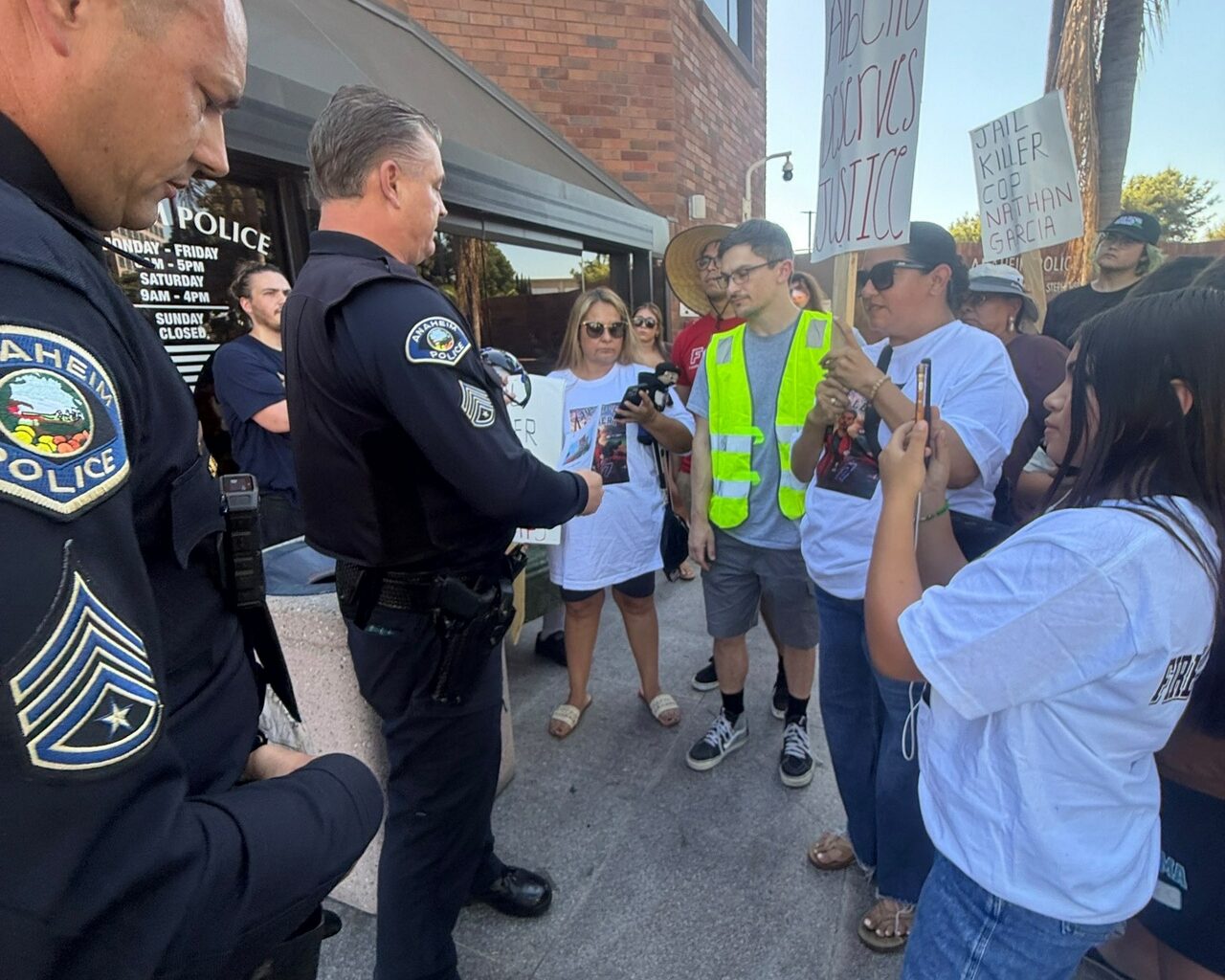 Protesters deliver petition demanding justice for Albert Arzola.