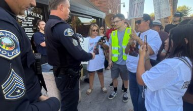 Protesters deliver petition demanding justice for Albert Arzola.