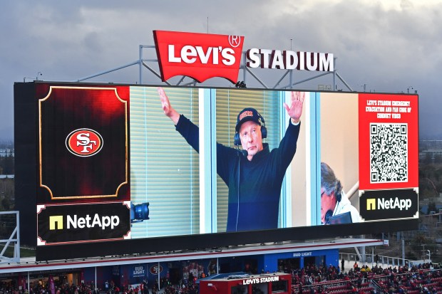 Greg Papa waves to the audience from the broadcast booth before their NFL game at Levi's Stadium in Santa Clara, Calif., on Saturday, Jan. 3, 2026. Papa returns to the radio broadcast booth for the first time since his cancer diagnosis. Papa is is in remission battling leukemia. (Jose Carlos Fajardo/Bay Area News Group)
