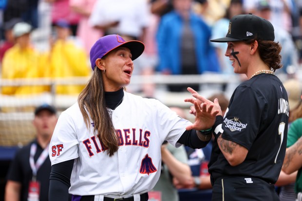 SPRINGFIELD, ILLINOIS - AUGUST 01: Kelsie Whitmore #3 of the San Francisco Firebells and Ashton Lansdell #1 of the Los Angeles Queens interact before the Women's Pro Baseball League Opening Day between New York Heights and the Los Angeles Queens at Robin Roberts Stadium on August 01, 2026 in Springfield, Illinois. (Photo by Jessie Alcheh/Getty Images)