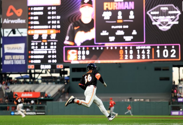 San Francisco Giants' Nate Furman (56) runs to first base after his first major league hit during the third inning of a MLB game against the Cincinnati Reds at Oracle Park in San Francisco, Tuesday, Aug. 25, 2026. (Ray Chavez/Bay Area News Group)