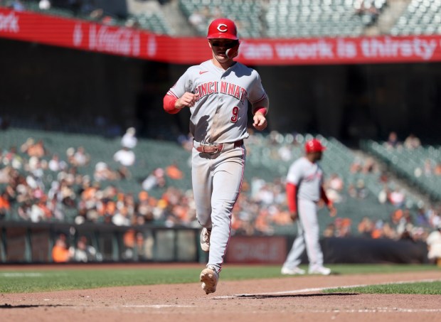 Cincinnati Reds' Matt McLain #9 scores the game-winning run on an RBI single by Tyler Stephenson #37 in the ninth inning of their MLB game against the San Francisco Giants at Oracle Park in San Francisco, Calif., on Wednesday, August 26, 2026. (Jane Tyska/Bay Area News Group)