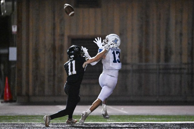 Acalanes' Finley Rivera (13) catches for a touchdown over Archbishop Mitty's Noah Fishman (11) during the first half at Foothill College in Los Altos Hills, Calif., on Friday, Aug. 28, 2026. (Thien-An Truong for Bay Area News Group)