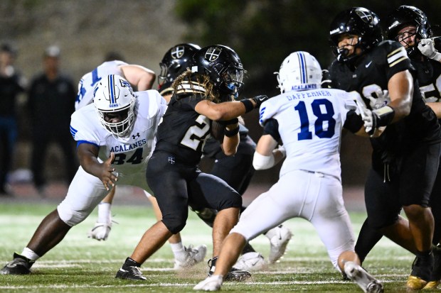 Archbishop Mitty's Justin Mungaray (24) runs the ball against Acalanes during the second half at Foothill College in Los Altos Hills, Calif., on Friday, Aug. 28, 2026. (Thien-An Truong for Bay Area News Group)