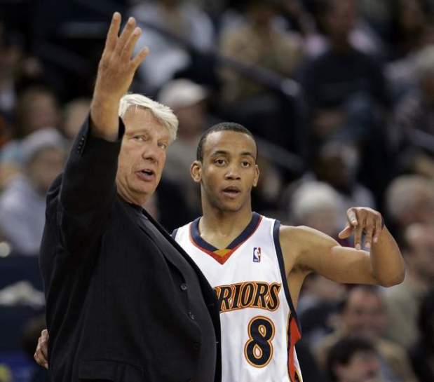 Golden State Warriors head coach Don Nelson, left, talks with guard Monta Ellis (8) in the second quarter against the Minnesota Timberwolves during their NBA basketball game in Oakland, Calif., Sunday, April 15, 2007. (AP Photo/Paul Sakuma)