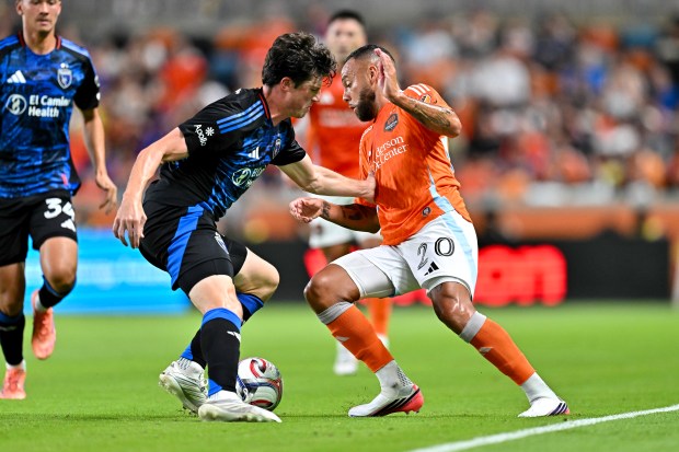 HOUSTON, TEXAS - AUGUST 29: Guilherme #20 of the Houston Dynamo FC and Daniel Munie #5 of the San Jose Earthquakes battle for ball possession during the first half of their match at Shell Energy Stadium on August 29, 2026 in Houston, Texas. (Photo by Maria Lysaker/Getty Images)
