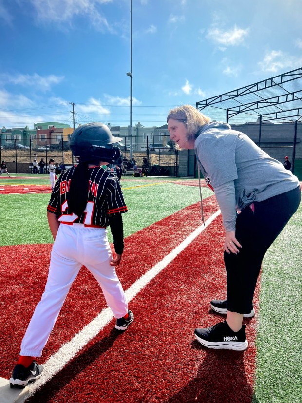 Rocky Henley coaches a young San Francisco Bay Sox player. (Courtesy of San Francisco Bay Sox)
