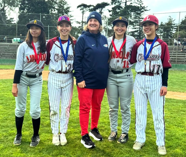 Rocky Henley with San Francisco Bay Sox alumni in their high school baseball jerseys. (Courtesy of the San Francisco Bay Sox)