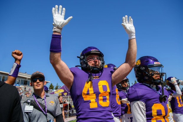 San Jose City College defensive lineman Justin Buzzard (48) raises his hands in celebration after a touchdown in the fourth quarter during their game against College of the Redwoods at San Jose City College in San Jose, Calif., on Saturday, Aug. 29, 2026. Buzzard, a 47-year-old father of three and pastor, is playing college football to fulfill a long-delayed dream. (Jose Carlos Fajardo/Bay Area News Group)