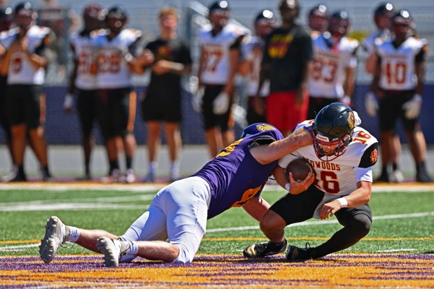 San Jose City College defensive lineman Justin Buzzard (48) tackles College of the Redwoods quarterback LandonMcKee (16) in the fourth quarter of their game at San Jose City College in San Jose, Calif., on Saturday, Aug. 29, 2026. Buzzard, a 47-year-old father of three and pastor, is playing college football to fulfill a long-delayed dream. (Jose Carlos Fajardo/Bay Area News Group)
