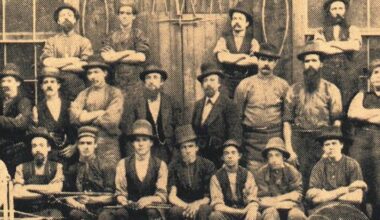 black and white image of men circa 1860s in victorian dress