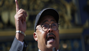A man holds his hand up in the air