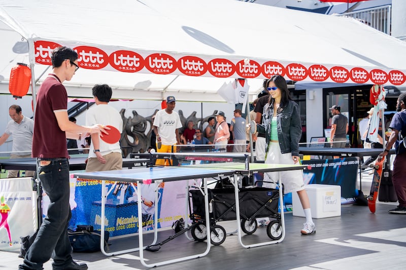 Attendees join the table tennis court set up by Little Tokyo Table Tennis in Weller Court.