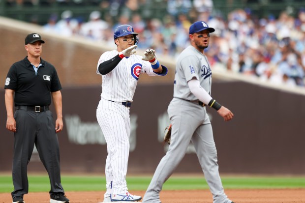 Cubs right fielder Seiya Suzuki motions to the dugout after hitting a double in the fourth inning against the Dodgers on Wednesday, Aug. 5, 2026, at Wrigley Field. (Eileen T. Meslar/Chicago Tribune)