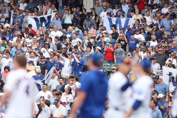 Fans celebrate after the Cubs defeated the Dodgers 7-6 on Wednesday, Aug. 5, 2026, at Wrigley Field. (Eileen T. Meslar/Chicago Tribune)