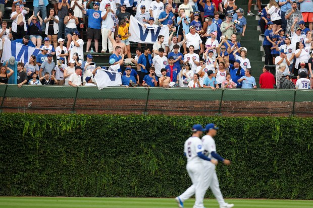 Fans celebrate after the Cubs defeated the Dodgers 7-6 on Wednesday, Aug. 5, 2026, at Wrigley Field. (Eileen T. Meslar/Chicago Tribune)