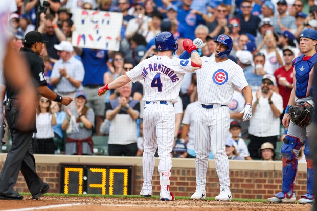 Cubs designated hitter Pete Crow-Armstrong (4) celebrates with center fielder Tyrone Taylor after hitting a two-run home run in the fourth inning against the Dodgers on Wednesday, Aug. 5, 2026, at Wrigley Field. (Eileen T. Meslar/Chicago Tribune)