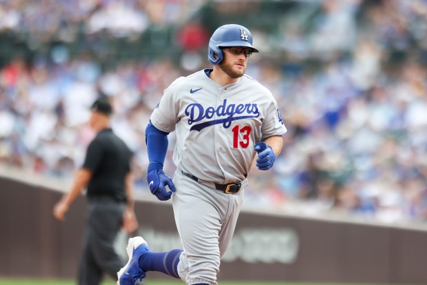 Dodgers third baseman Max Muncy rounds the bases after hitting a three-run home run in the eighth inning against the Cubs on Wednesday, Aug. 5, 2026, at Wrigley Field. (Eileen T. Meslar/Chicago Tribune)