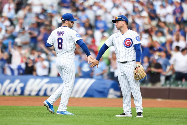 Ian Happ (8) and Alex Bregman celebrate after the Cubs' 7-6 victory against the Dodgers on Wednesday, Aug. 5, 2026, at Wrigley Field. (Eileen T. Meslar/Chicago Tribune)