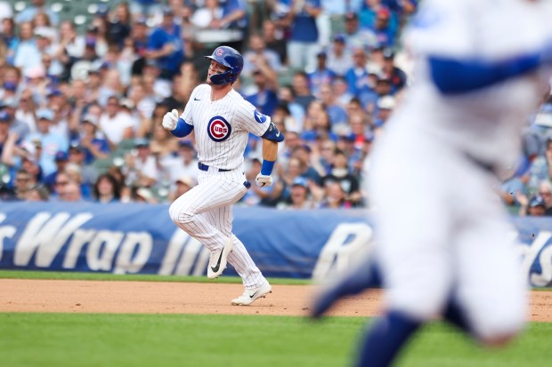 Cubs second baseman Nico Hoerner runs to second base after hitting an RBI double in the seventh inning against the Dodgers on Wednesday, Aug. 5, 2026, at Wrigley Field. (Eileen T. Meslar/Chicago Tribune)
